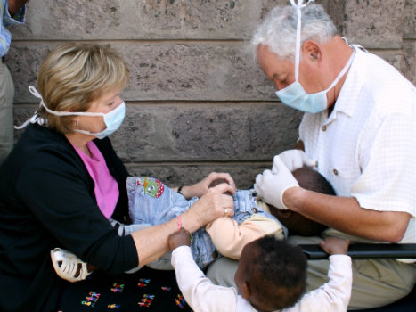 Dr. Hunter working with children
